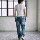 Model wearing Washed Buckle Jeans M