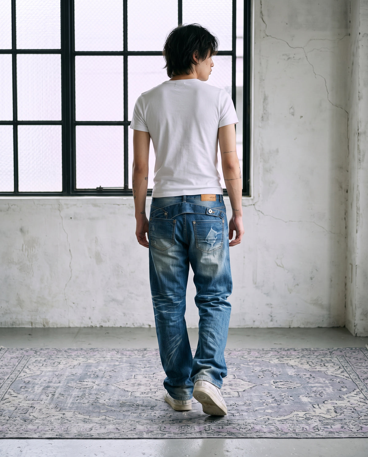 Model wearing Washed Buckle Jeans M